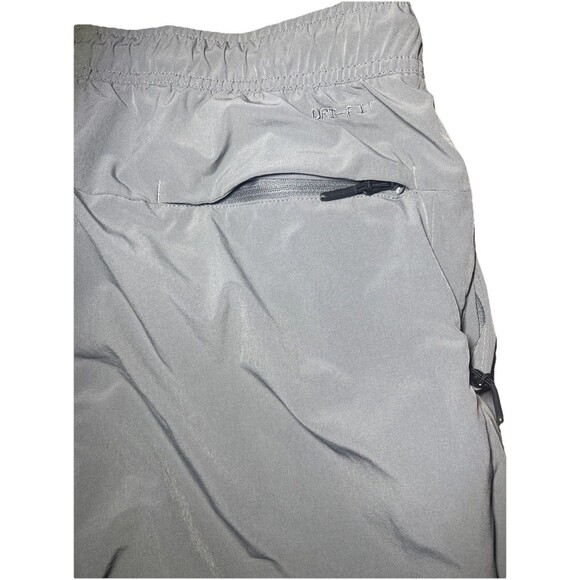 Medium Nike unlimited Men’s Dri-Fit Zip Cuff Versatile Pants Smoke Grey - Picture 7 of 8